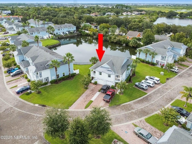 aerial view with a residential view and a water view