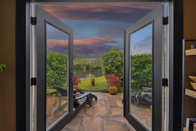 doorway with stone finish flooring and a wealth of natural light