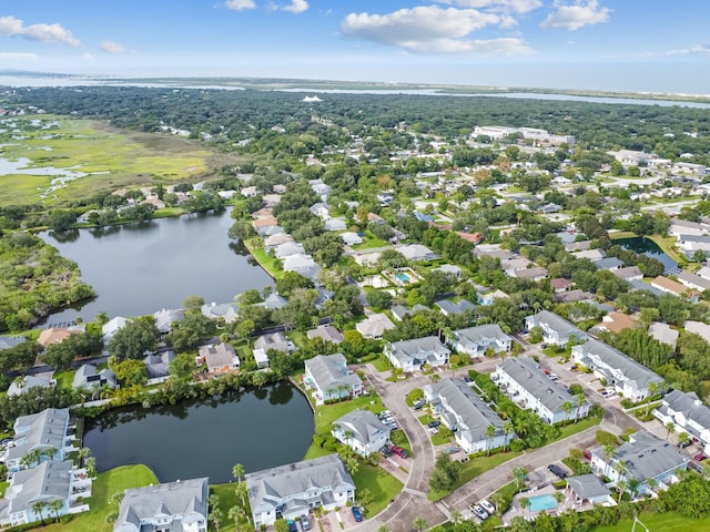 birds eye view of property with a residential view and a water view