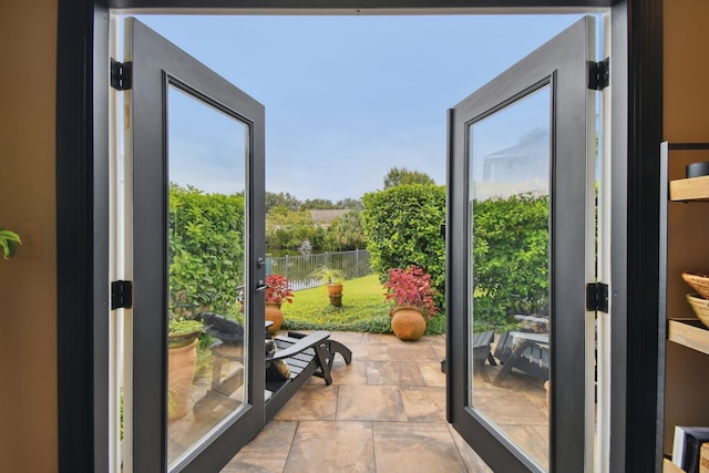 doorway to outside featuring stone finish floor