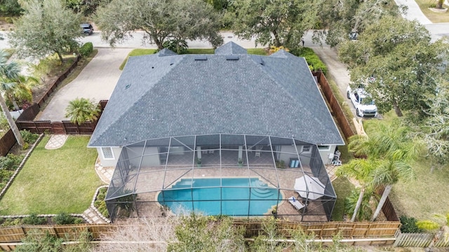 view of pool featuring a patio, a lanai, and a lawn