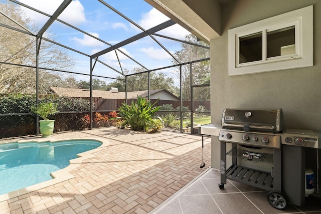 view of pool featuring a grill, a lanai, and a patio