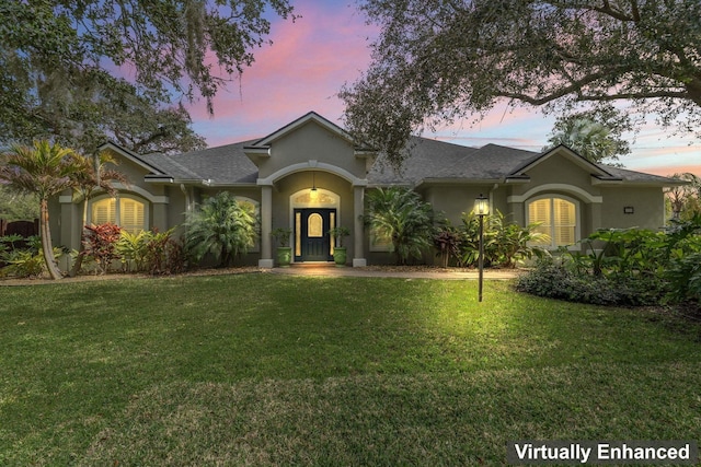 ranch-style house with a yard