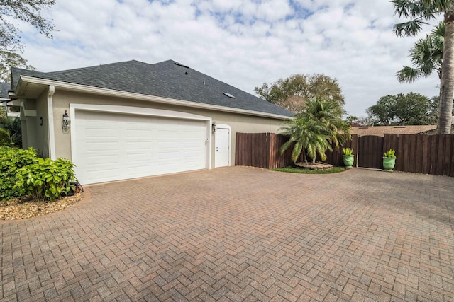 view of side of property featuring a garage