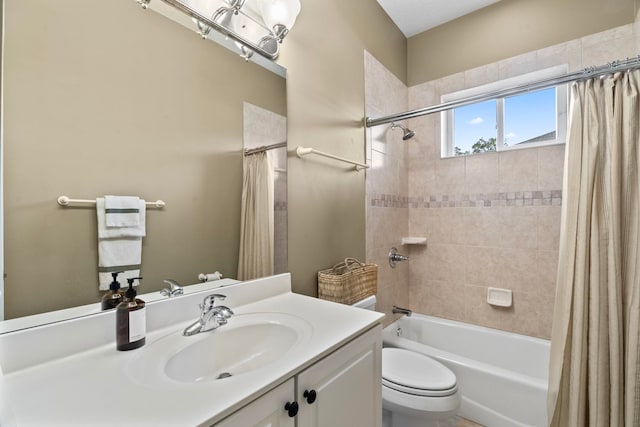 full bathroom featuring shower / bath combination with curtain, vanity, and toilet