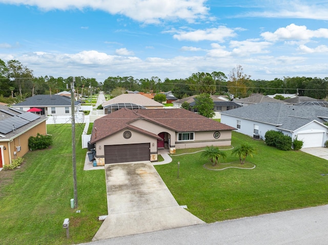 view of front of home featuring a garage and a front yard