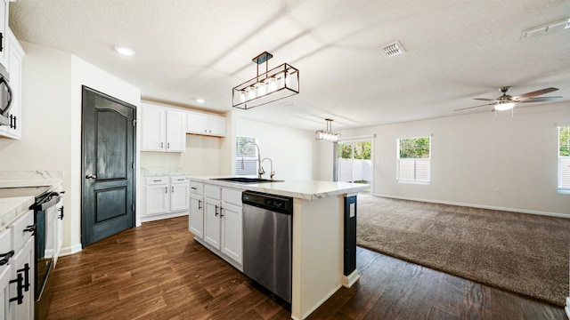 kitchen with pendant lighting, a center island with sink, sink, white cabinetry, and stainless steel appliances