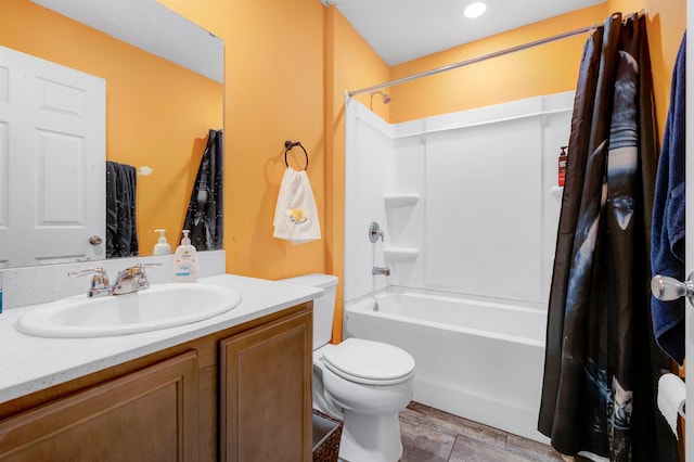 full bathroom featuring tile patterned floors, toilet, vanity, and shower / bath combination with curtain