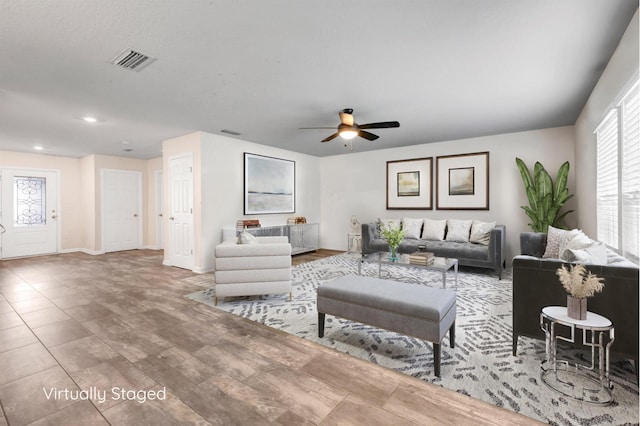 living room with ceiling fan