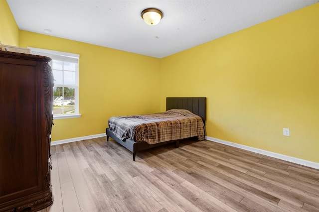 bedroom featuring light wood-type flooring