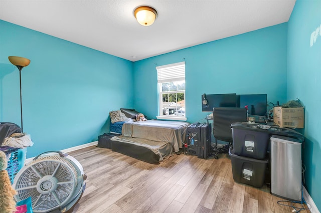 bedroom with light hardwood / wood-style flooring