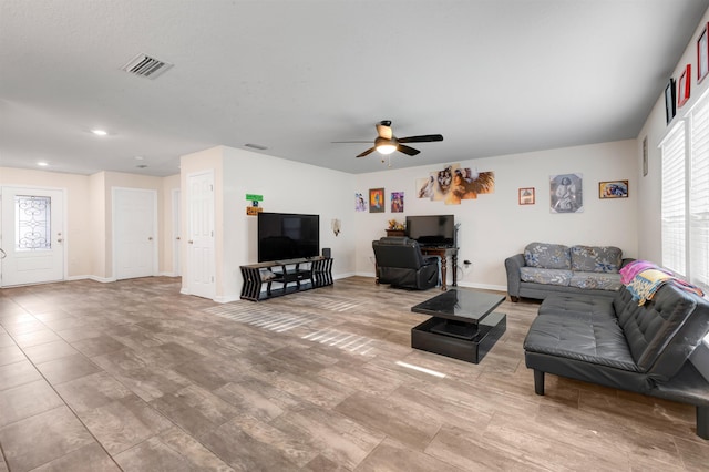 living room featuring ceiling fan