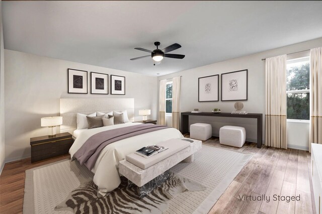 bedroom featuring ceiling fan and hardwood / wood-style floors