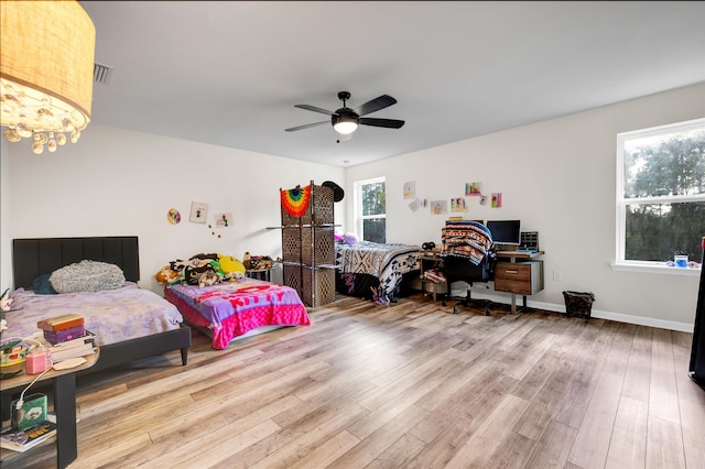 bedroom featuring ceiling fan and light hardwood / wood-style floors