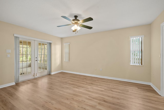 76 Kakakee Trl, Palm Coast, FL 32164 - unfurnished room with french doors, plenty of natural light, light wood finished floors, and a ceiling fan