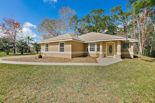 76 Kakakee Trl, Palm Coast, FL 32164 - ranch-style house with stucco siding and a front lawn