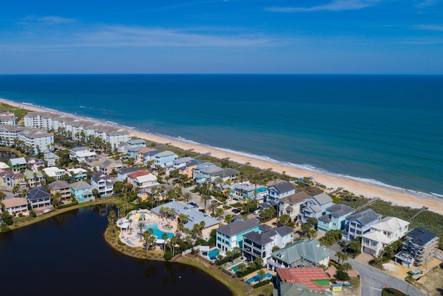 aerial view with a water view and a view of the beach