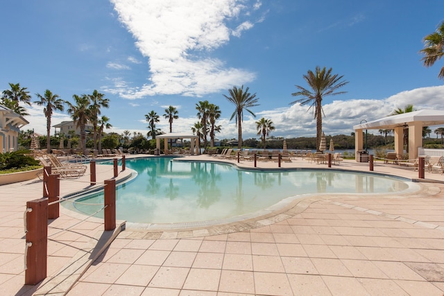 view of swimming pool with a patio area