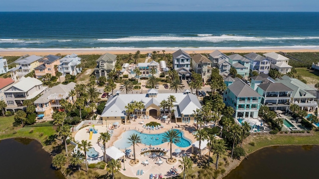 aerial view featuring a view of the beach and a water view