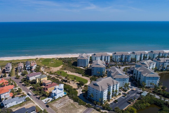 bird's eye view featuring a water view and a view of the beach