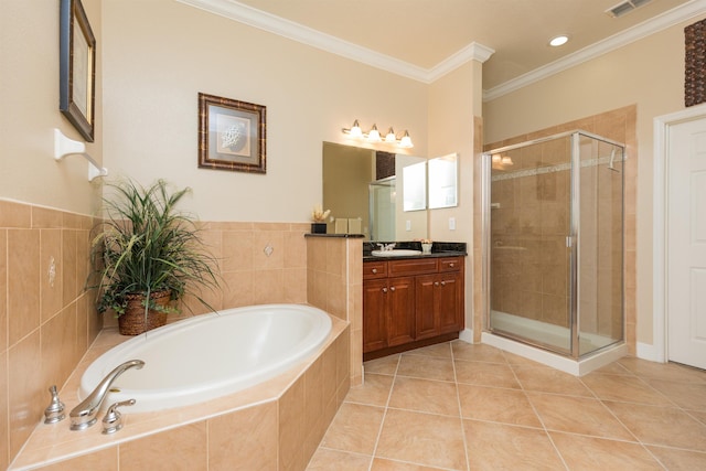 bathroom with tile patterned flooring, vanity, crown molding, and shower with separate bathtub