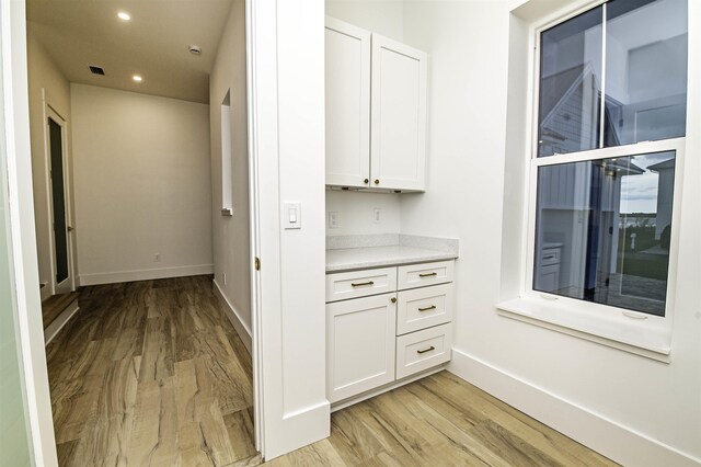 corridor featuring light hardwood / wood-style flooring