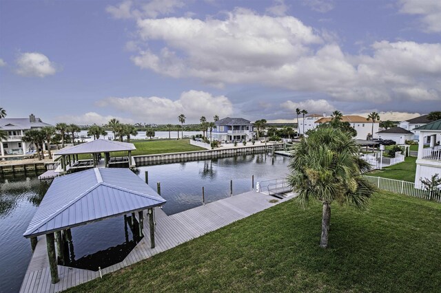 dock area featuring a yard and a water view