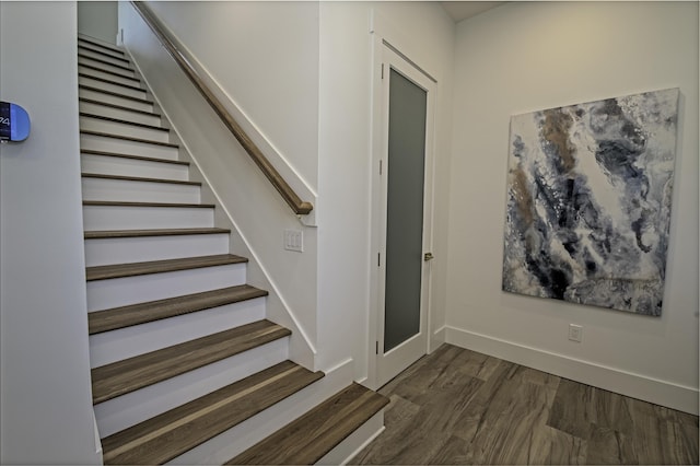 stairs with hardwood / wood-style flooring