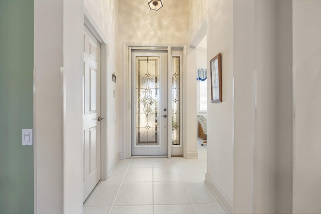 entryway featuring light tile patterned floors