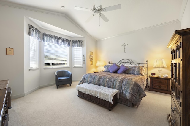 bedroom featuring ceiling fan, crown molding, light colored carpet, and vaulted ceiling