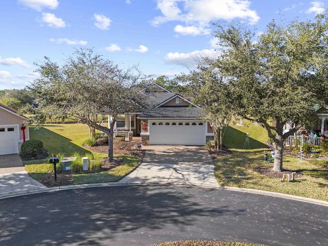 view of front of property with a front lawn and a garage