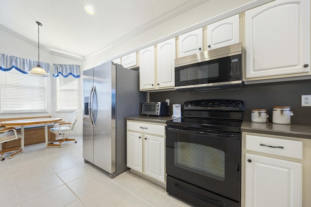 kitchen featuring white cabinets, pendant lighting, lofted ceiling, and appliances with stainless steel finishes