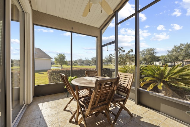 sunroom featuring ceiling fan