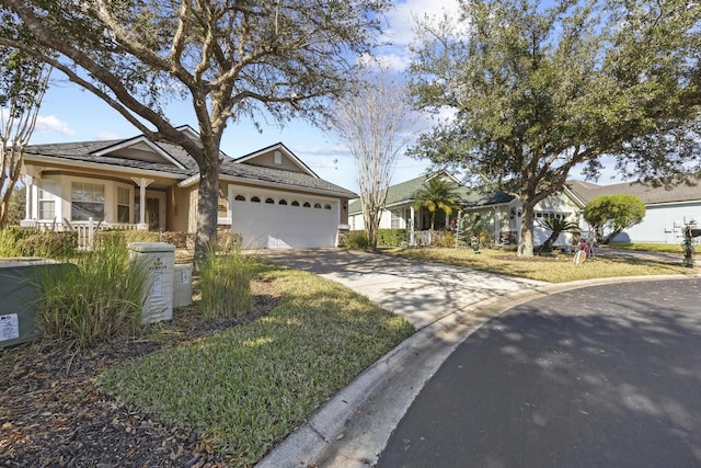 ranch-style house with a garage and a front lawn