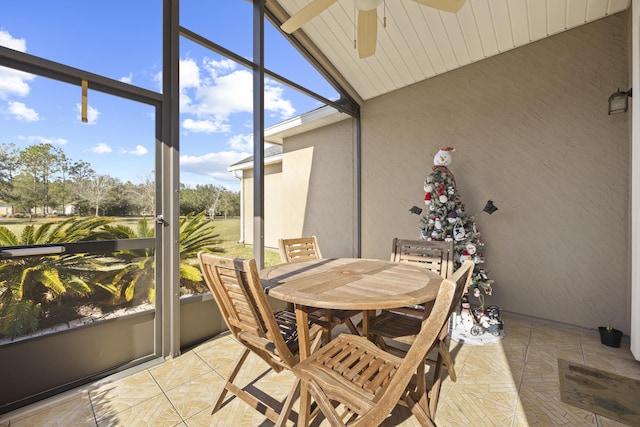 sunroom featuring ceiling fan