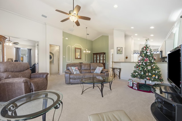 living room featuring lofted ceiling, ceiling fan with notable chandelier, light colored carpet, and crown molding