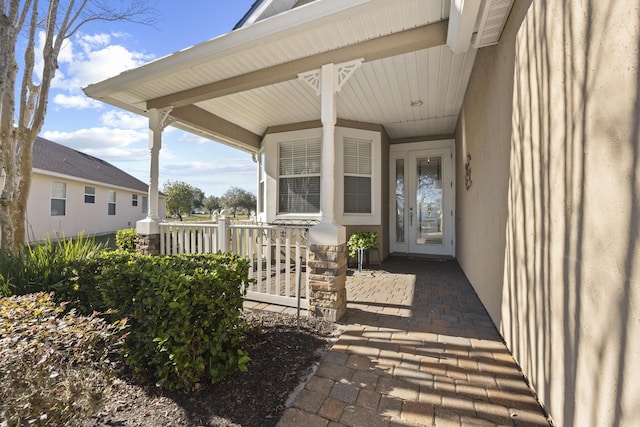 property entrance with covered porch