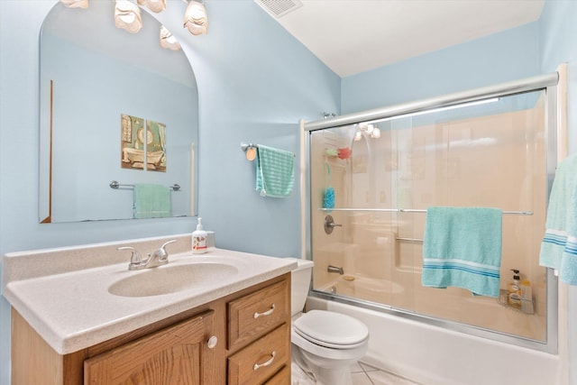 full bathroom featuring tile patterned floors, vanity, toilet, and combined bath / shower with glass door