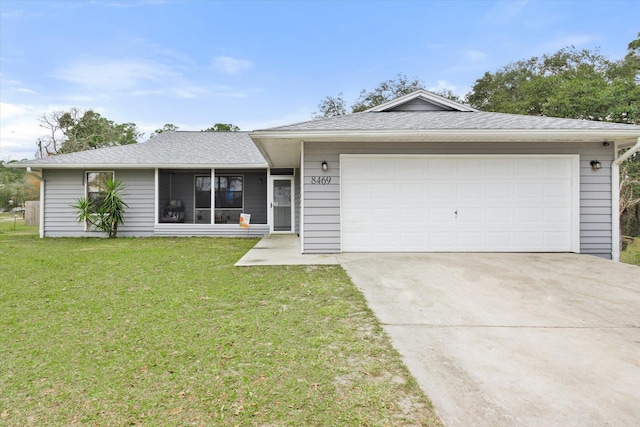 ranch-style house with a garage and a front yard