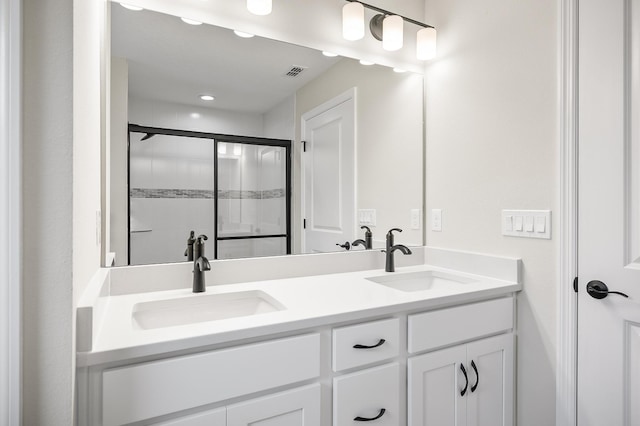 bathroom with an enclosed shower and vanity