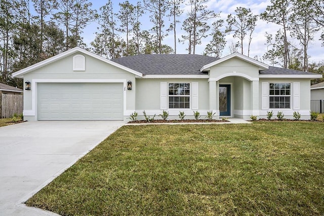 ranch-style house with a garage and a front lawn