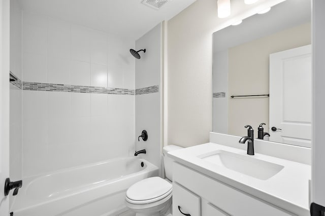 full bathroom with vanity, toilet, and tiled shower / bath