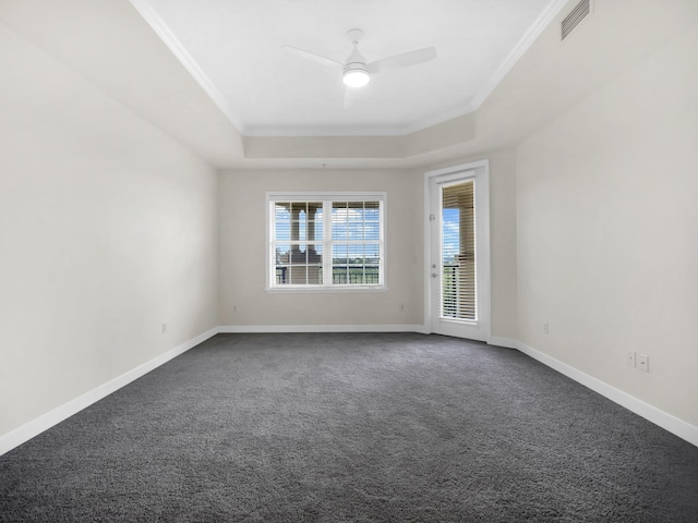 150 Pantano Cay Blvd Unit 2303, Saint Augustine, FL 32080 - empty room with a raised ceiling, ornamental molding, dark carpet, a ceiling fan, and baseboards