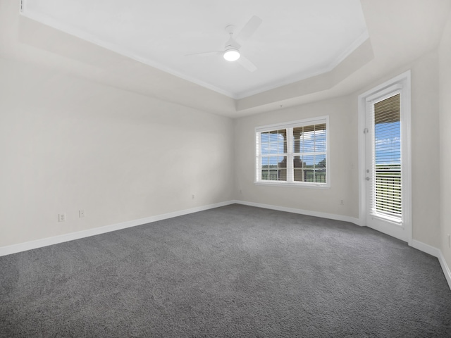 150 Pantano Cay Blvd Unit 2303, Saint Augustine, FL 32080 - spare room with a raised ceiling, dark carpet, ceiling fan, baseboards, and crown molding