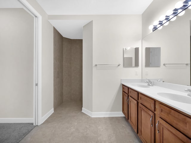 150 Pantano Cay Blvd Unit 2303, Saint Augustine, FL 32080 - bathroom featuring double vanity, baseboards, a tile shower, and tile patterned floors