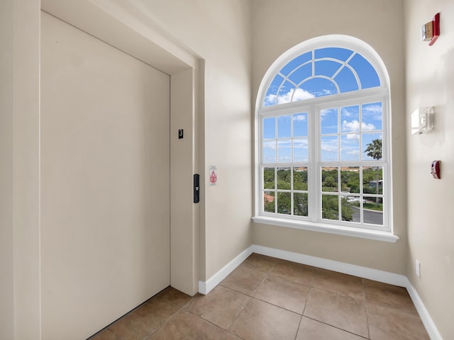 150 Pantano Cay Blvd Unit 2303, Saint Augustine, FL 32080 - unfurnished room with elevator, baseboards, and light tile patterned flooring