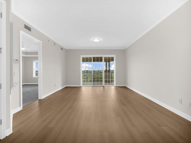 150 Pantano Cay Blvd Unit 2303, Saint Augustine, FL 32080 - unfurnished room with crown molding, wood finished floors, and baseboards