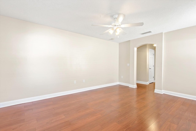 unfurnished room with hardwood / wood-style flooring, a textured ceiling, and ceiling fan