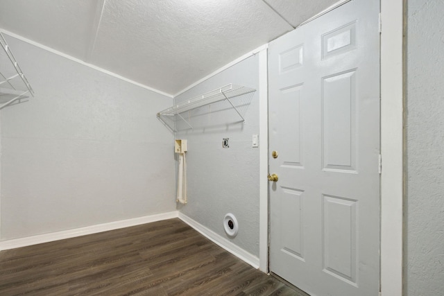 laundry area featuring electric dryer hookup and dark hardwood / wood-style flooring