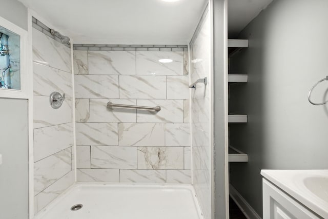 bathroom featuring vanity and a tile shower